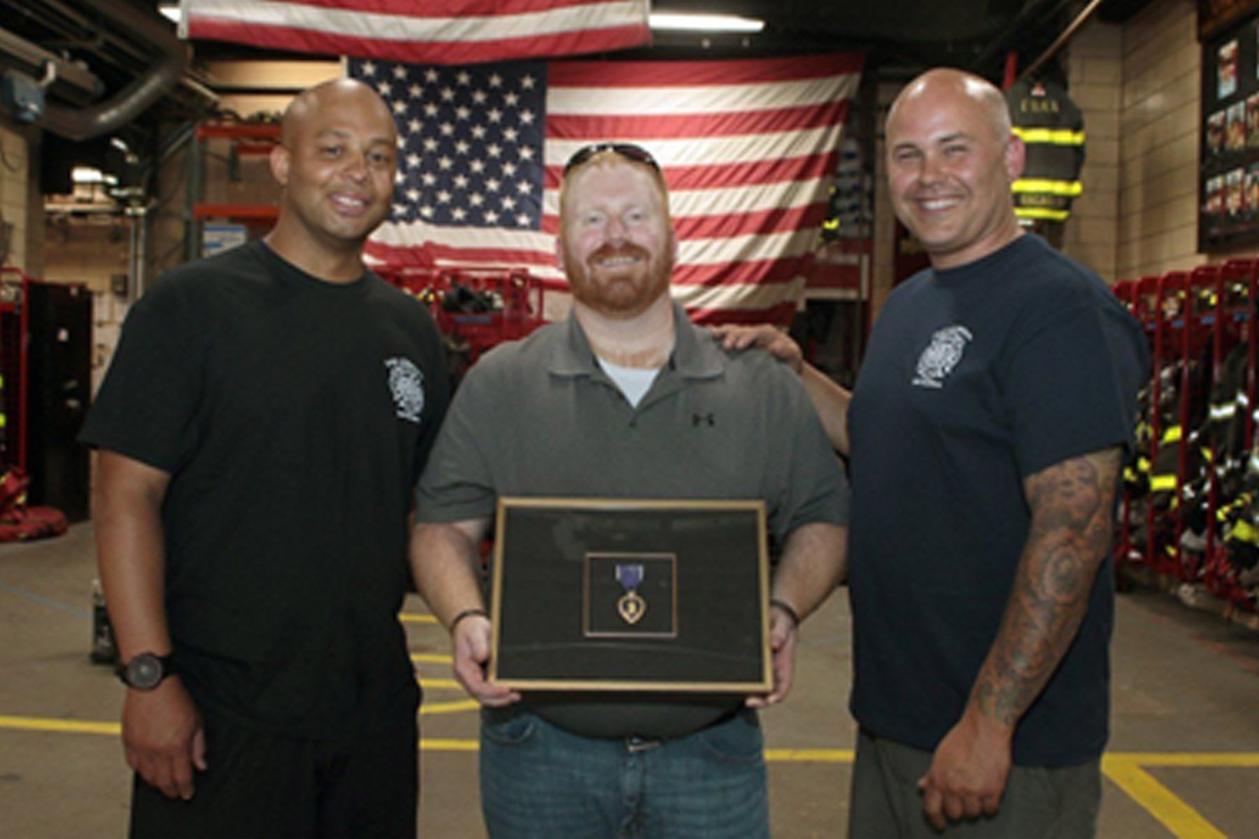 Charles Wayne O'Brien, purple heart recipient, giving his medal to the NYC Firefighter Station 54 - example of a symbol