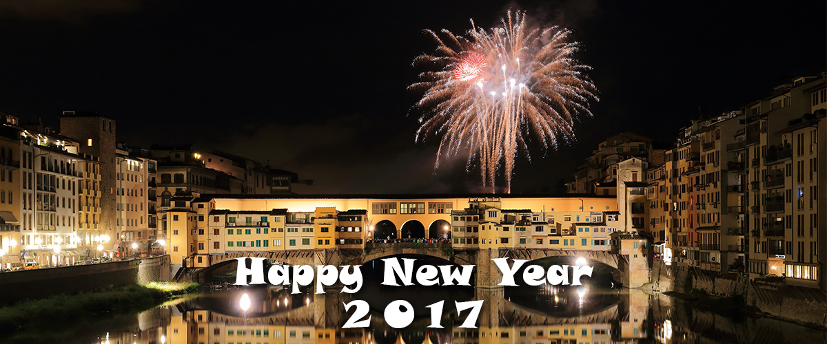 happy new year 2017 with fireworks going off over the Ponte Vecchio, Old Bridge, in Florence, Italy