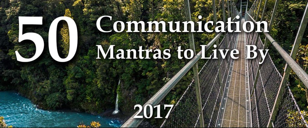 Pedestrian suspension bridge over a beautiful blue river with overlay text 50 business storytelling mantras to live by 2017