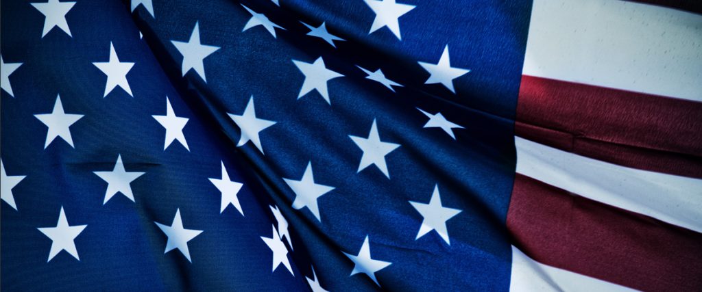 flag of the united states of america waving in honor of veteran's day 2017