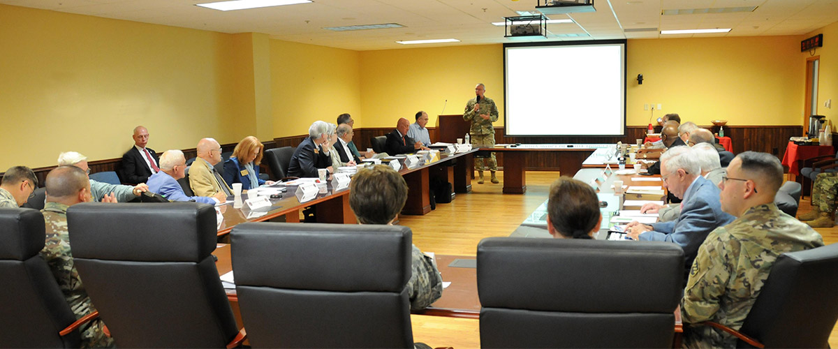 conference room for US Army, mixed attendance of military and civilian, general officer presenting to group