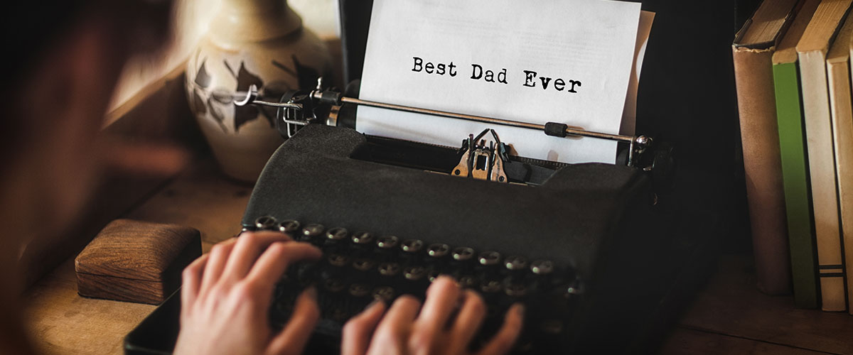hands typing on old school typewriter, "Best dad ever" to underscore message for business story of importance of his dad