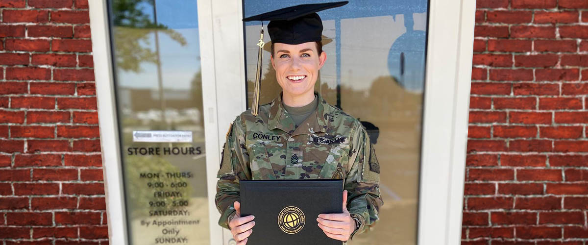 beat the odds - new college graduate Brittany, in US Army uniform, with graduation cap