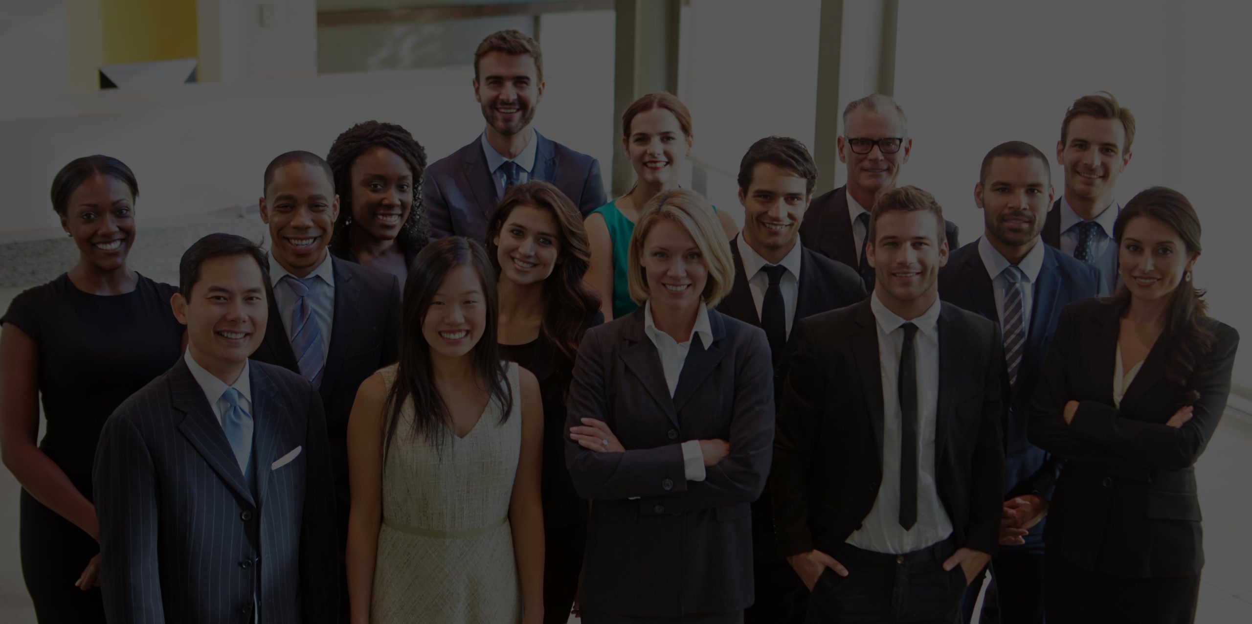 ergs improve employee engagement with better communication - group of professionals, standing, mixed gender, mixed race, mixed ages smiling