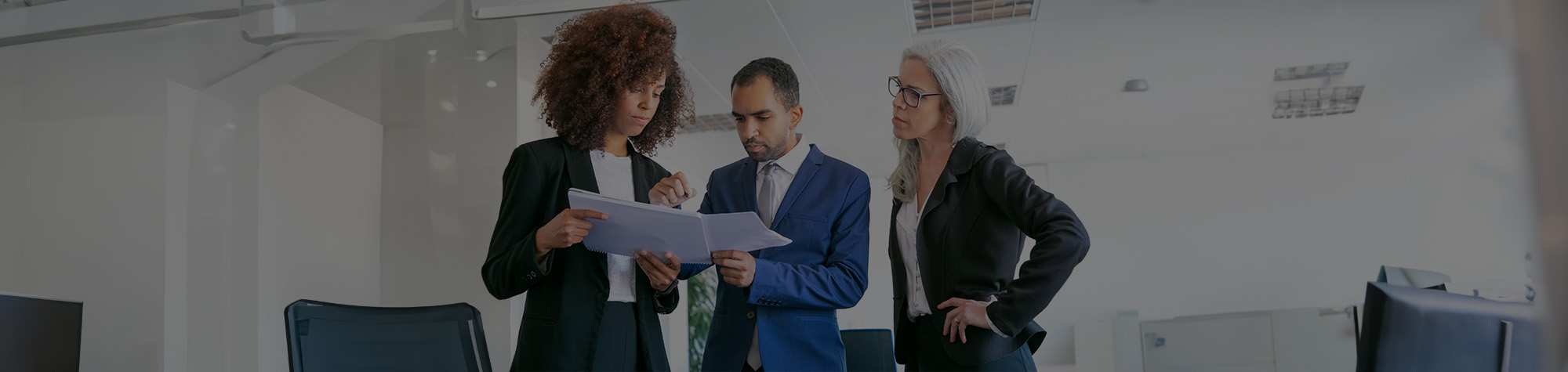 two female executives with one male executive, practicing sales to the power of storytelling coach concepts