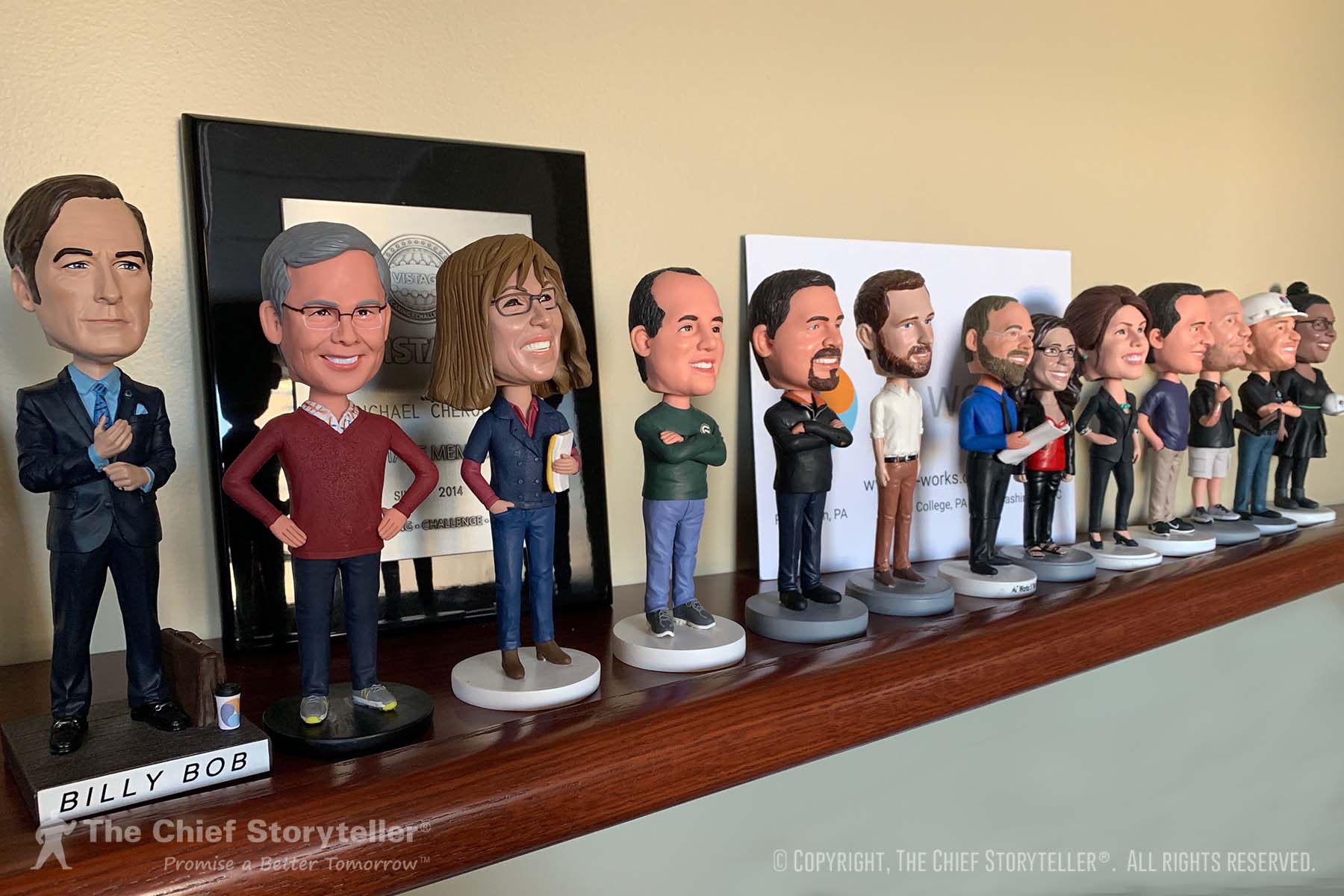 bobble heads awarded at five-year anniversary - example of a symbol
