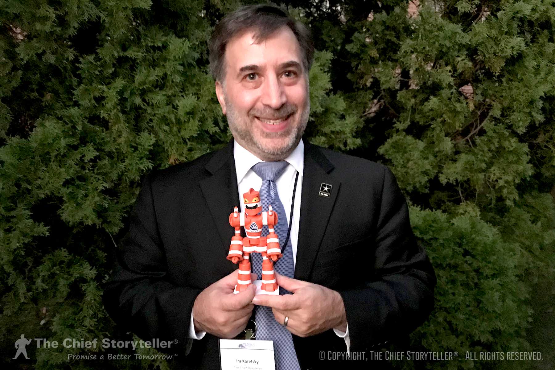 Ira Koretsky holding Wally the Work Zone Warrior, a 7" figurine, from the Secretary of Transportation of Delaware - example of a symbol