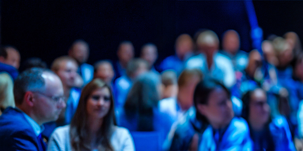 conference presentation services showing three part image of male executive speaker, this is the left